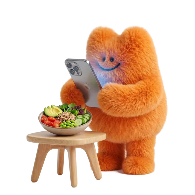 Fuzzy, the TrackAI mascot, photographing a salad bowl with an iPhone